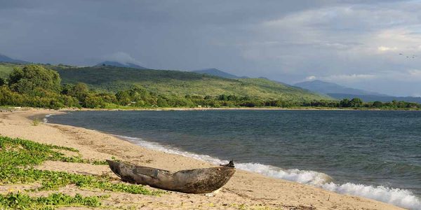 Tanzania, Malawi lake is the Worlds longest and second deepest fresh water lake, it is also one of the oldest lakes on the planet. The picture presents beautiful sand beach and traditional dugout canoe